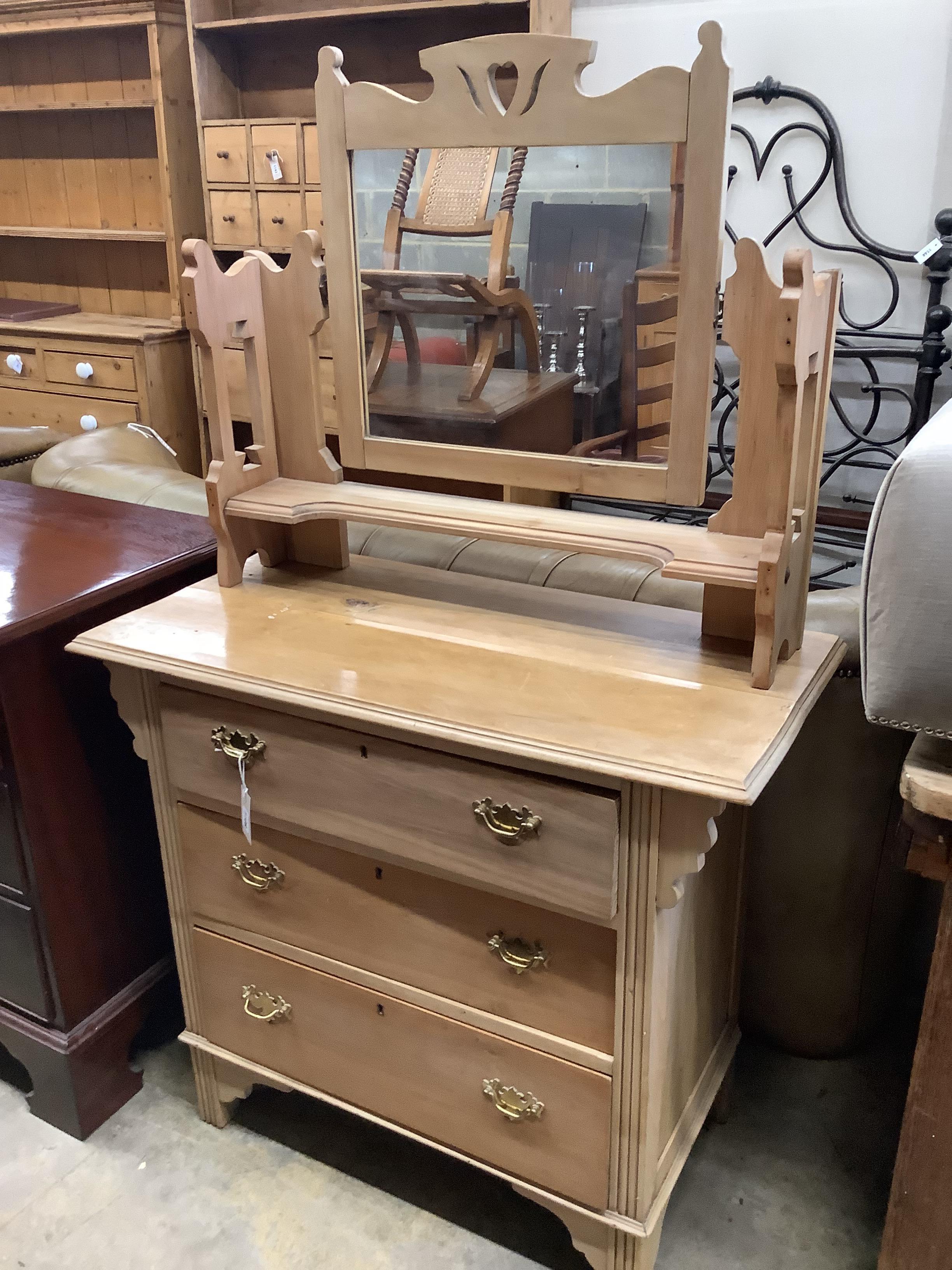 A late Victorian satin walnut dressing chest with swing mirror, width 91cm, depth 45cm, height 150cm